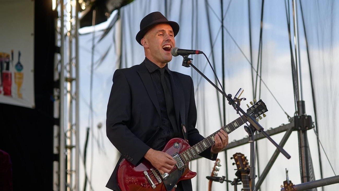 Dave performing on guitar