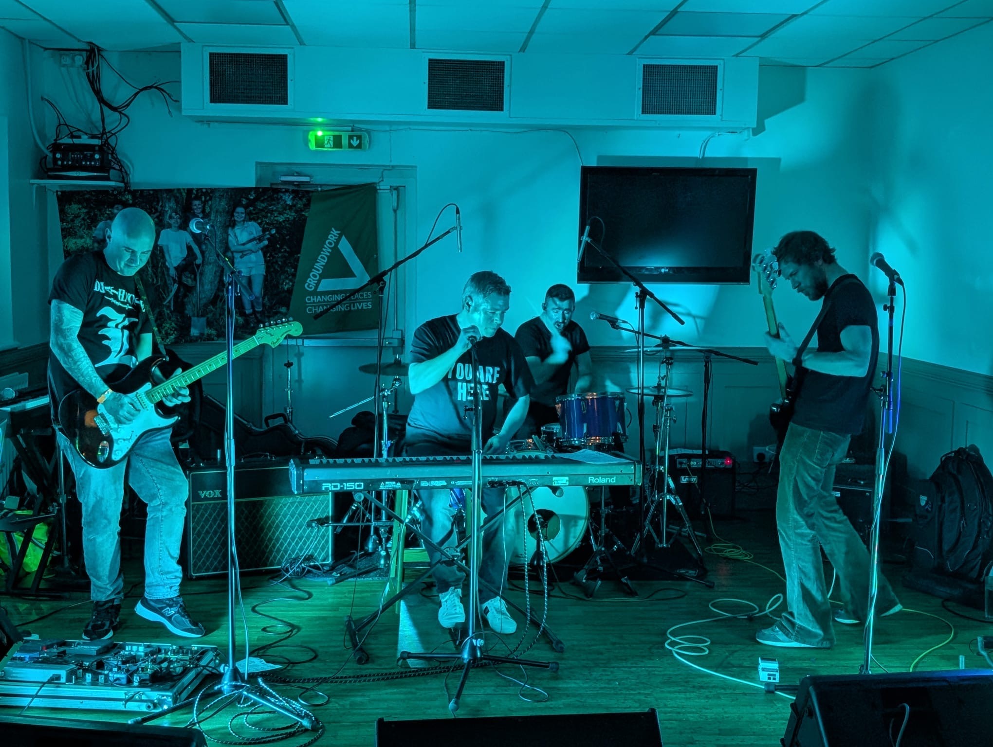 The Replays live on stage with guitars, keys and drums